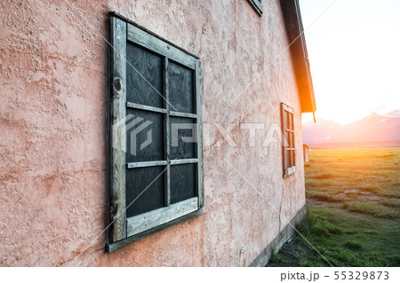 Old rusty wooden frame on stone painted pink wall Old rusty wooden frame on stone painted pink wall 55329873