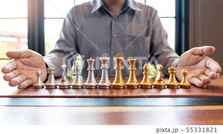 Business man moving chess game for business 55331821