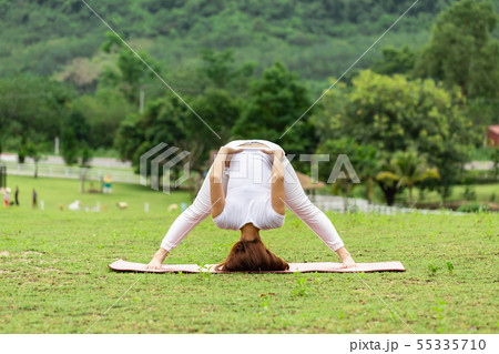 woman practice yoga Spread foot stretching pose woman practice yoga Spread foot stretching pose 55335710