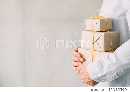 corporate party beige gift boxes man hands corporate party beige gift boxes man hands 55336549
