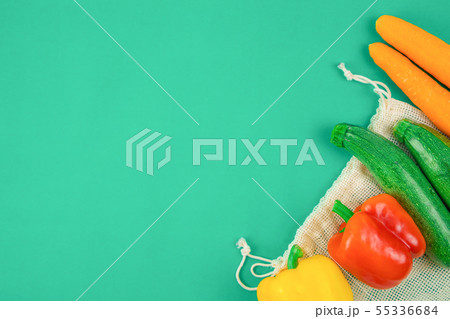 Vegetables on reusable grcery bag cut off. 55336684