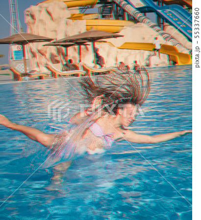 Young brunette girl in a pink bathing suit funny 55337660