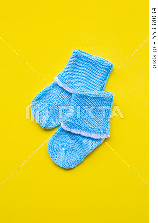 Baby socks on yellow background. 55338034