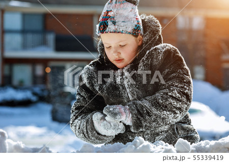 Happy laughing little girl wearing playing and Happy laughing little girl wearing playing and 55339419