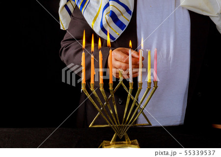 Jewish man blessings Chanukah menorah traditional Jewish man blessings Chanukah menorah traditional 55339537