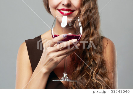 smiling woman with glass of wine smiling woman with glass of wine 55345040