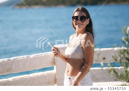 Young sport woman use wireless headphones for listening music until she running in the morning on Young sport woman use wireless headphones for listening music until she running in the morning on 55345720