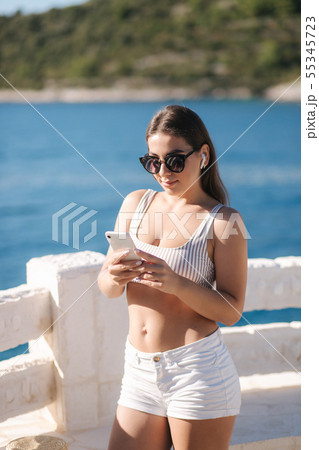 Young sport woman use wireless headphones for listening music until she running in the morning on Young sport woman use wireless headphones for listening music until she running in the morning on 55345723