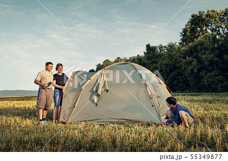 Family set up tent camp at sunset, beautiful Family set up tent camp at sunset, beautiful 55349877