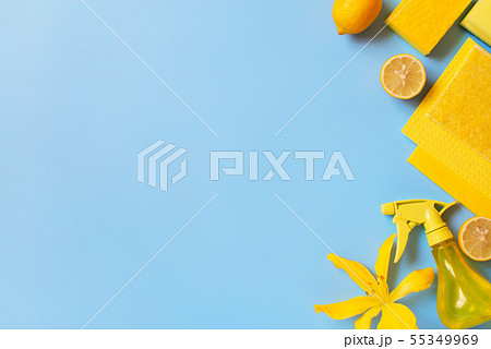 Blue background with cleaning supplies and lemons 55349969