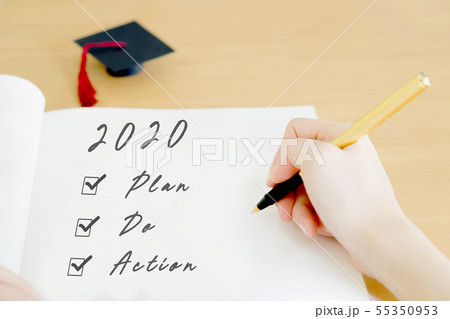 Woman writing on paper 55350953