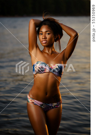 Young athletic dark skinned girl in swimsuit Young athletic dark skinned girl in swimsuit 55350969