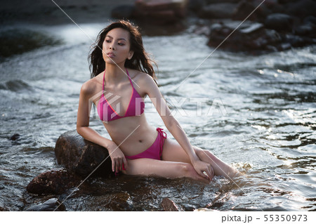 Young lean pretty asian girl in two pieces pink Young lean pretty asian girl in two pieces pink 55350973