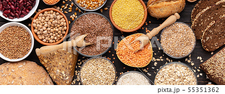 Gluten free different grains and bread on wooden background Gluten free different grains and bread on wooden background 55351362