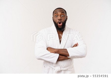 Portrait of excited young African American male screaming in shock and amazement holding hands on Portrait of excited young African American male screaming in shock and amazement holding hands on 55354591