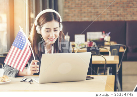 Young american woman using laptop celebrate on 4th Young american woman using laptop celebrate on 4th 55354748
