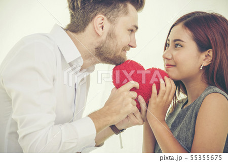 Couple lover in love holding red heart shape and 55355675
