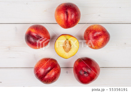 Fresh red nectarine on grey wood 55356191