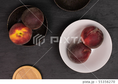 Fresh red peach on grey stone Fresh red peach on grey stone 55356270