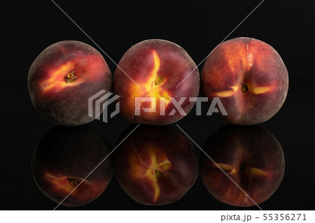 Fresh red peach isolated on black glass Fresh red peach isolated on black glass 55356271