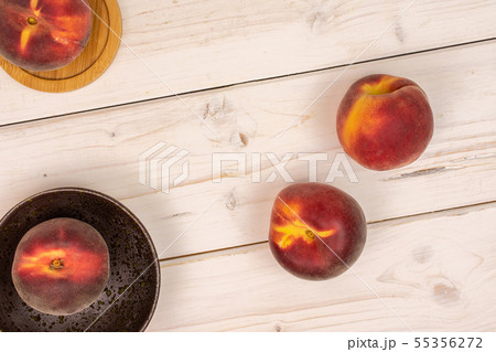 Fresh red peach on grey wood 55356272