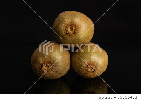 Fresh green kiwi isolated on black glass Fresh green kiwi isolated on black glass 55356433