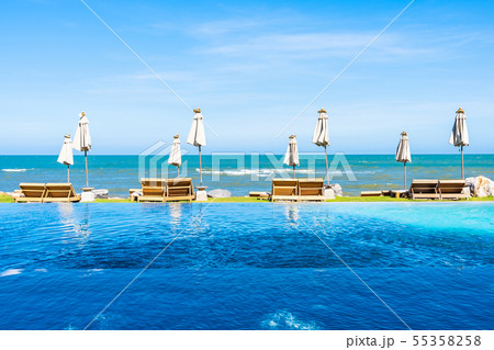 Beautiful outdoor nature landscape with bed deck chair around swimming pool in hotel resort 55358258