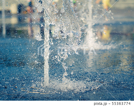 Water splashes on granite coating of dry fountain 55363774