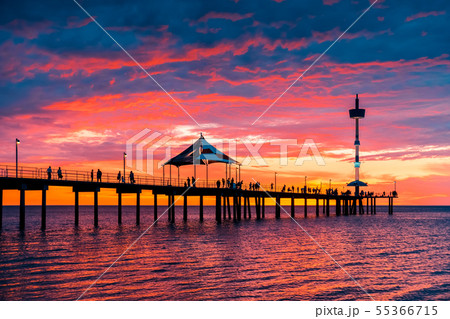 People walking along Brighton jetty at sunset People walking along Brighton jetty at sunset 55366715
