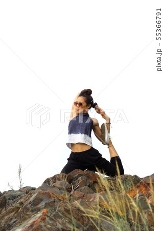 Yoga Gymnastics on the rock in white sky. 55366791