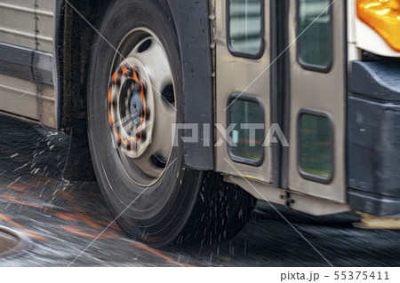 coach bus tire detail while raining in new york coach bus tire detail while raining in new york 55375411