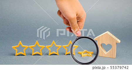 The fall fifth star near a miniature wooden house. The fall fifth star near a miniature wooden house. 55379742