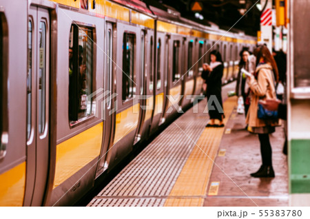 Tokyo JR train Chuo Sobu line at platform with Tokyo JR train Chuo Sobu line at platform with 55383780