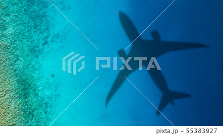 Travel concept with airplane shadow and sea 55383927