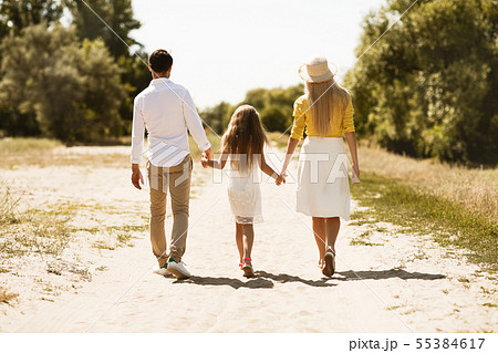 Young family spending time together outside in nature Young family spending time together outside in nature 55384617