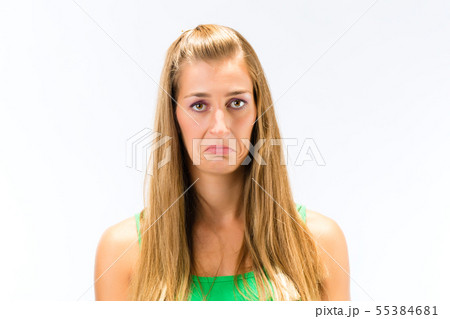 Blonde sad young woman Blonde sad young woman 55384681