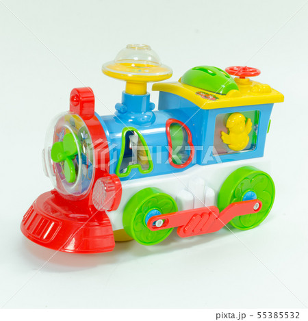 Plastic toy train isolated on white background. Children's toy plastic locomotive with abs letters. 55385532