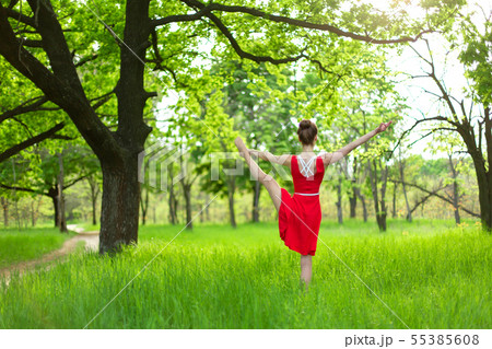 Slim beautiful brunette girl in a red dress Slim beautiful brunette girl in a red dress 55385608