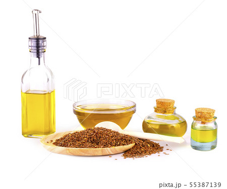 The Linseed oil, bowl of linseeds and wooden spoon 55387139