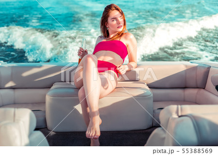 Thoughtful young pretty girl in a swimming suit Thoughtful young pretty girl in a swimming suit 55388569