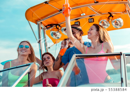 Group of happy young people throwing a party 55388584