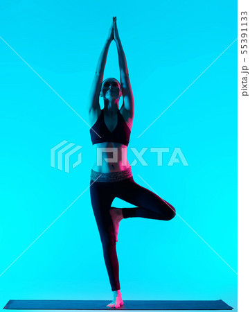woman Vriksasana yoga exercices tree pose woman Vriksasana yoga exercices tree pose 55391133