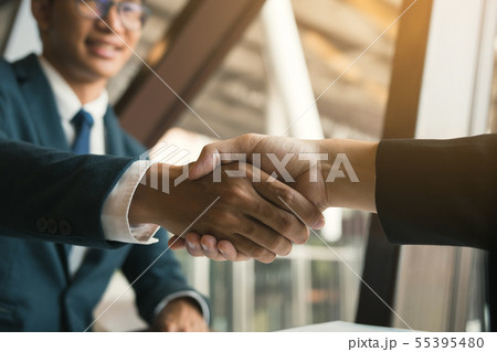 Entrepreneurs collaboration deal shaking hands in 55395480