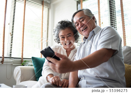 Happy Asian senior Couple using smartphone. Happy Asian senior Couple using smartphone. 55396275