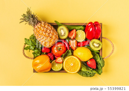 Fruits and vegetables rich in vitamin C in box. Fruits and vegetables rich in vitamin C in box. 55399821
