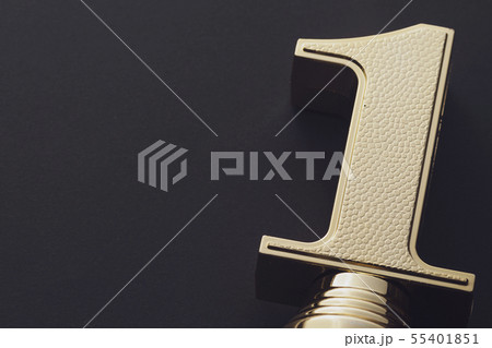 Golden statue award for winning first place 55401851