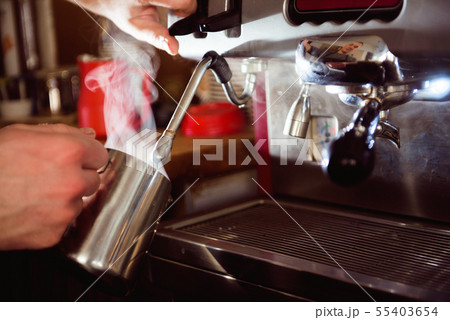 Barista making pattern in a cup of coffee shop. 55403654
