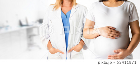 Pregnant Woman and Gynecologist Doctor at Hospital Pregnant Woman and Gynecologist Doctor at Hospital 55411971