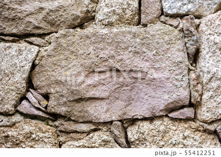 Texture of an irregular stone wall. Background. 55412251