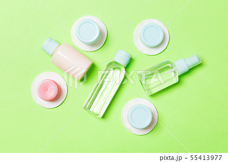Group of small bottles for travelling on green 55413977
